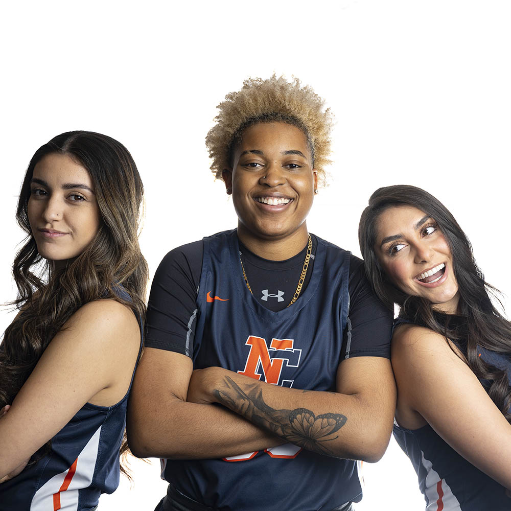 2022 senior players on the women's basketball team posing for camera